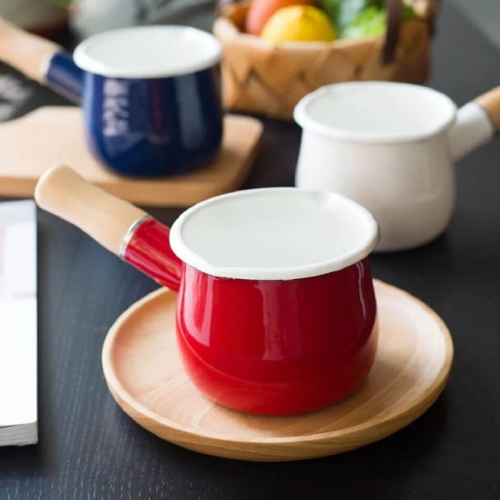 Mini enamel milk pot with wooden handle and dual pouring spouts, ideal for heating drinks and melting butter or chocolate (Red)